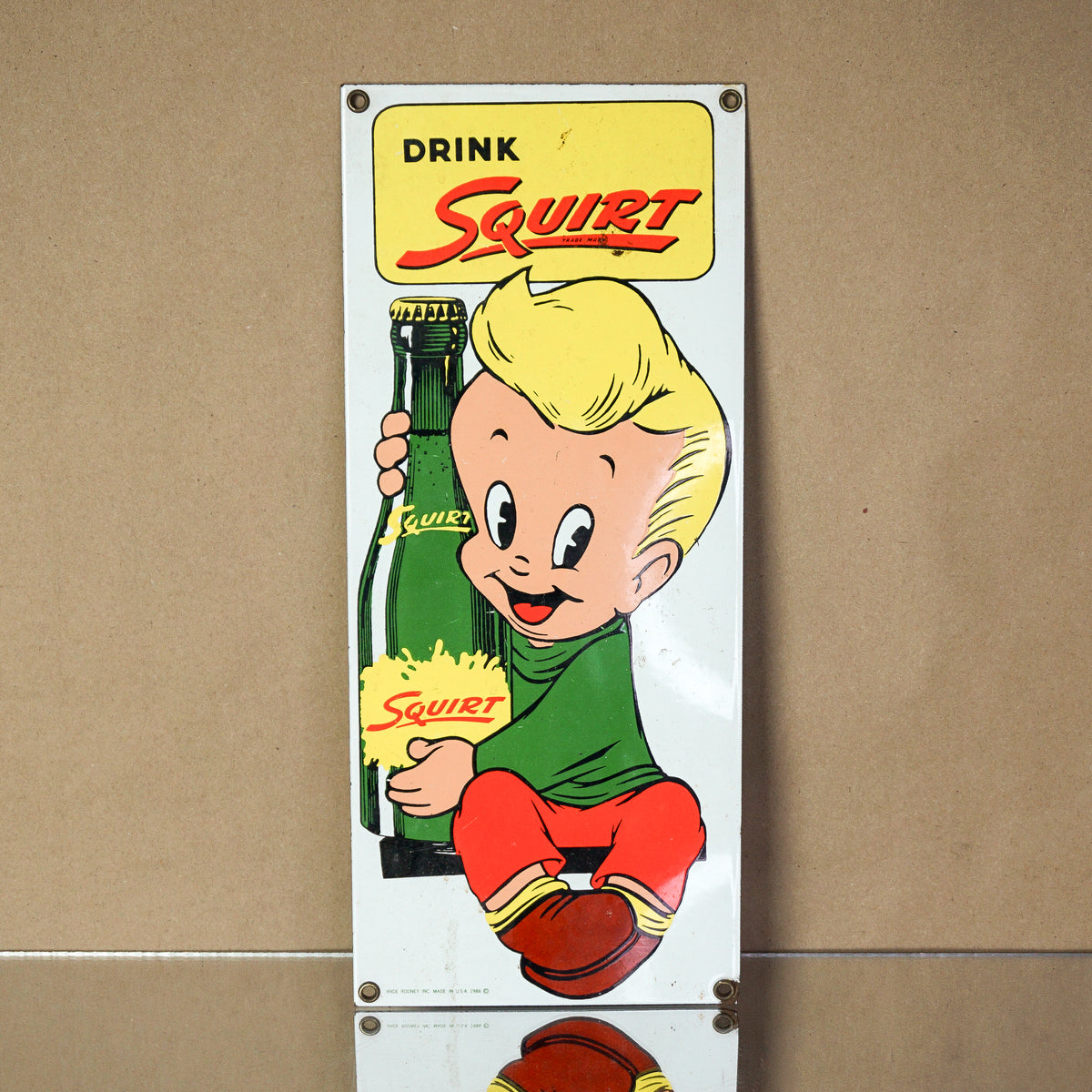 1986 Vintage Porcelain ANDRE ROONEY Little Squirt Soda Boy Sign