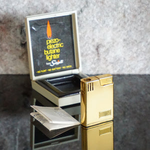 Collectible Vintage Gold Toned Piezoelectric Butane Lighter from SCRIPTO. Made in Japan.