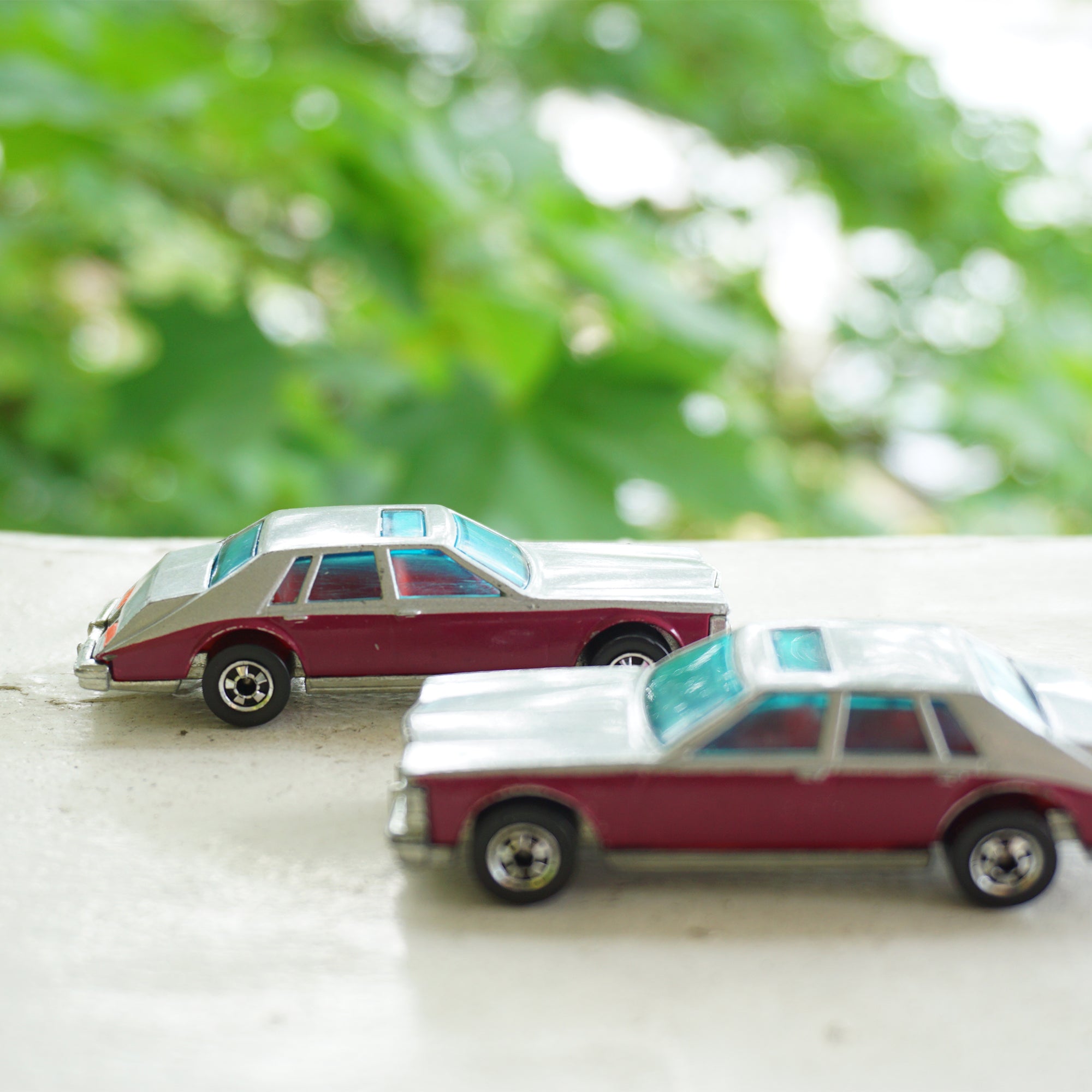 1980 Lot of 2 Vintage Diecast HOT WHEELS Cadillac Seville Burgundy Grey Cars. No. 1698. Made by Mattel, Inc.
