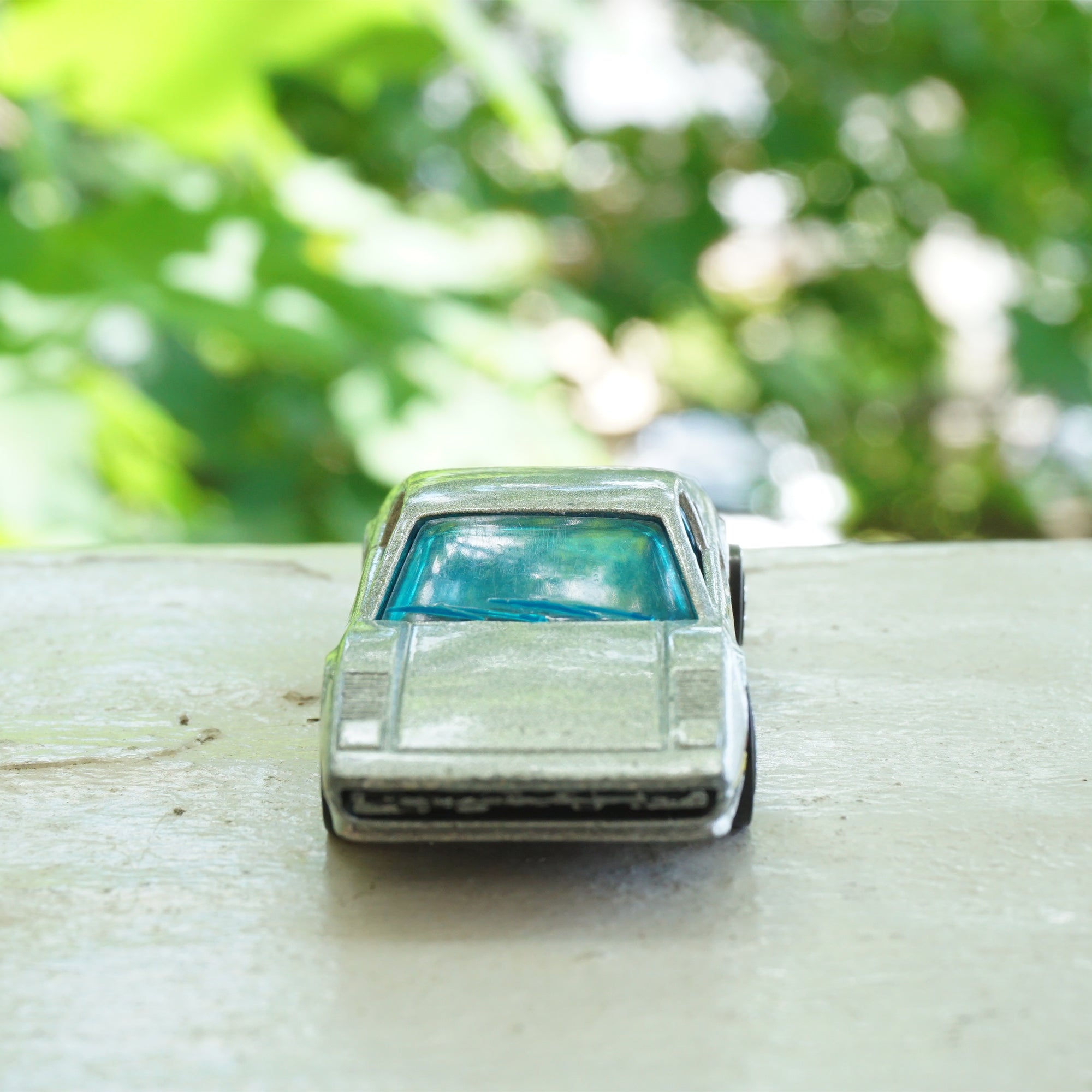 1982 Vintage HOT WHEELS Ferrari Racebait 308 Turbo SIlver Car with Red and Yellow Detail. Made by Mattel, Inc.