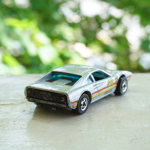 1982 Vintage HOT WHEELS Ferrari Racebait 308 Turbo SIlver Car with Red and Yellow Detail. Made by Mattel, Inc.