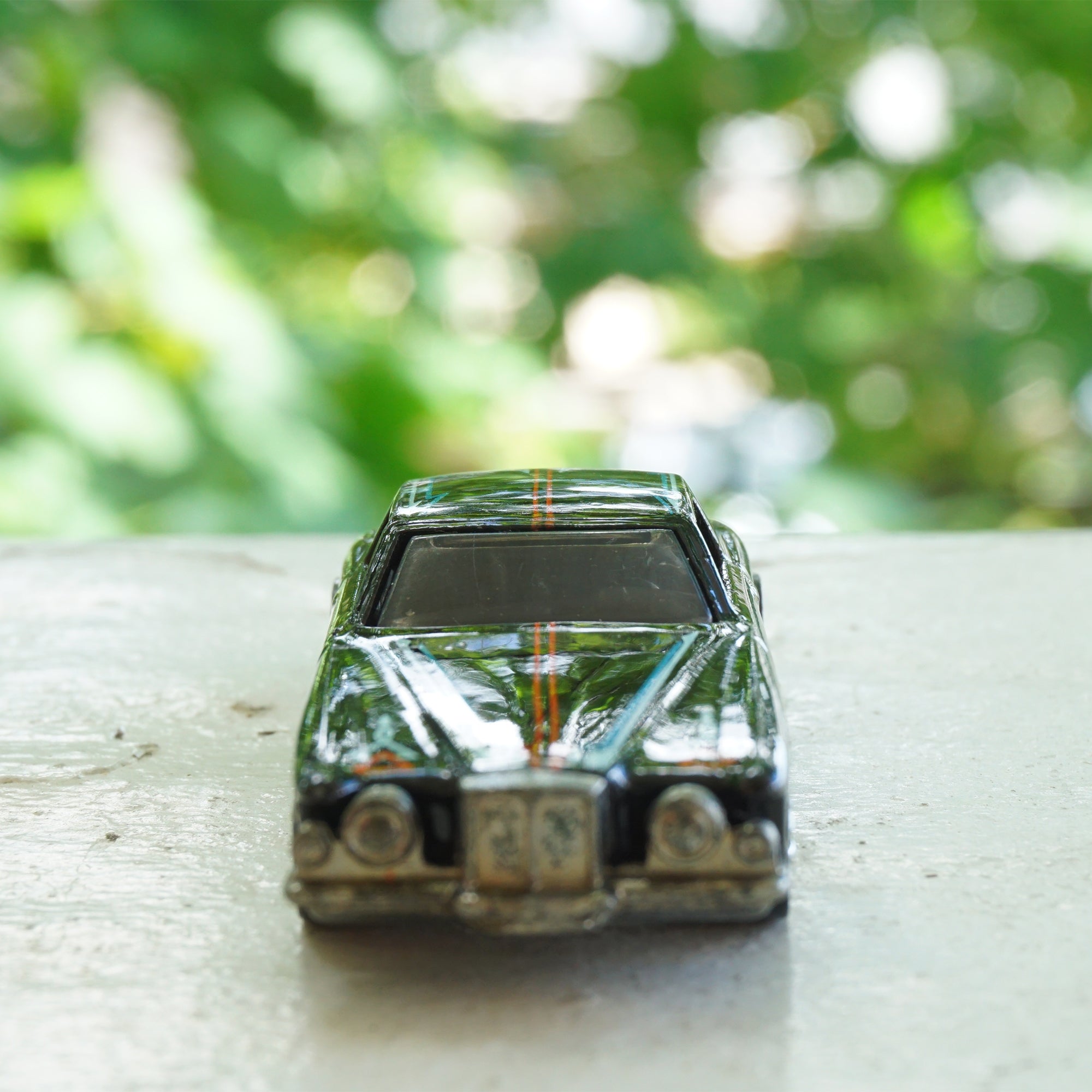 1979 Vintage HOT WHEELS Stutz Blackhawk Black Car with Red & Blue Line Detail. Made by Mattel, Inc in Malaysia.