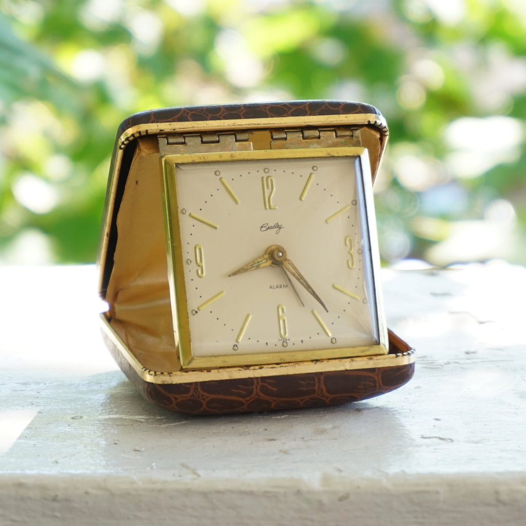 Vintage BRADLEY Gold Tone Mechanical Travel Alarm Clock in Brown Case. Made in Japan.