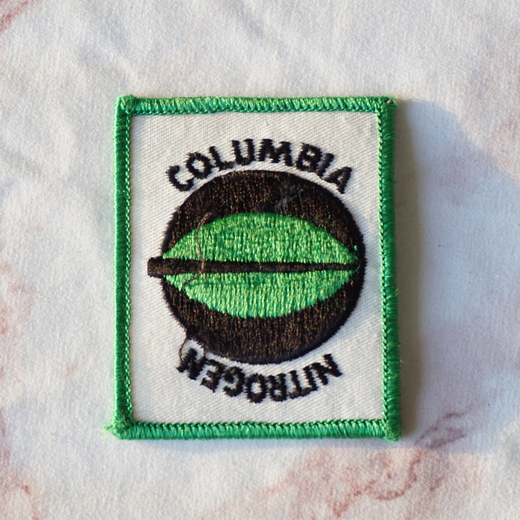 1980s Vintage 2.5" "COLUMBIA NITROGEN" Clothing Patch with Leaf. Black, White and Green Colors.