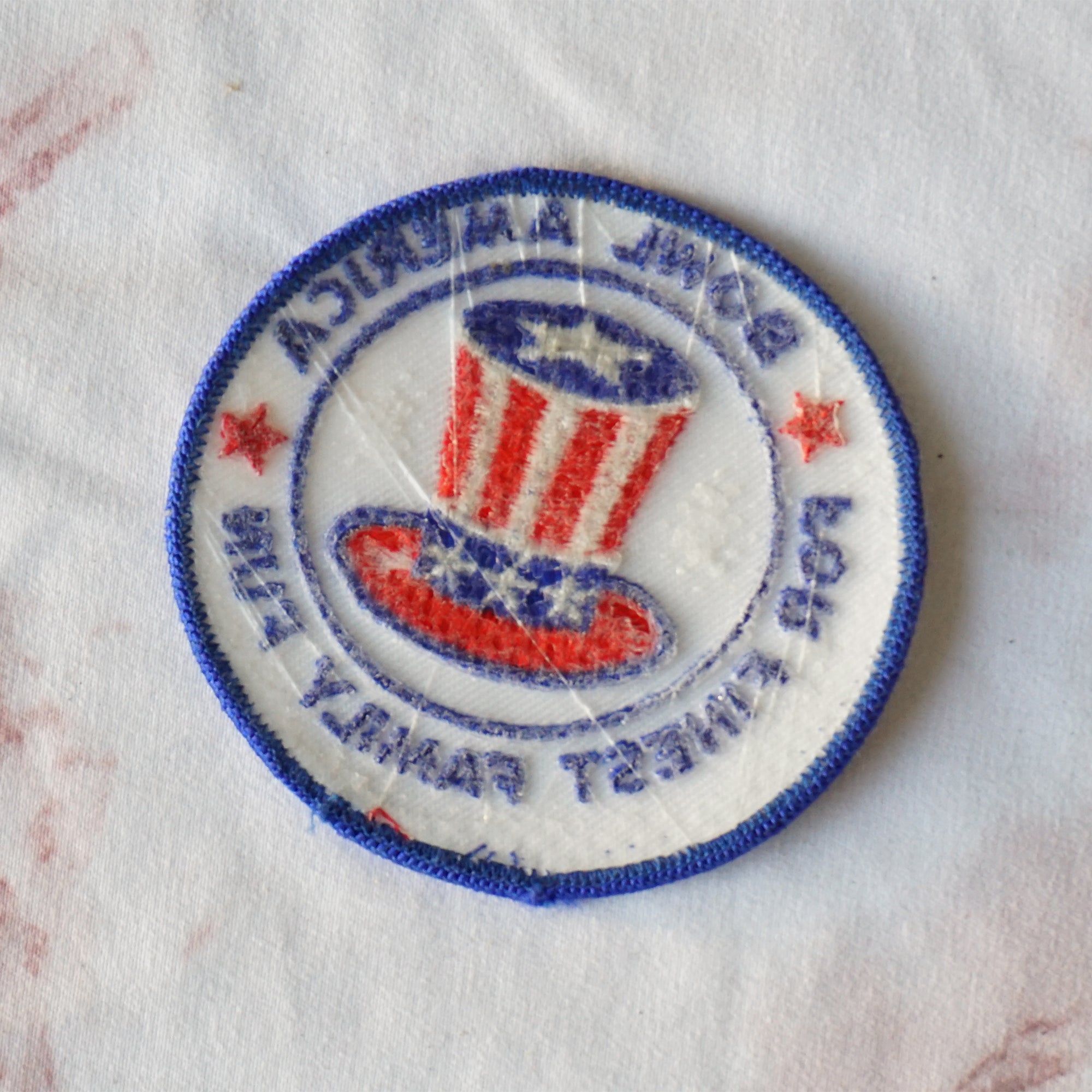 1980s Vintage 3" Bowl America For Finest Family Fun Clothing Patch with Flag Top Hat. Blue, Red and White Colors.