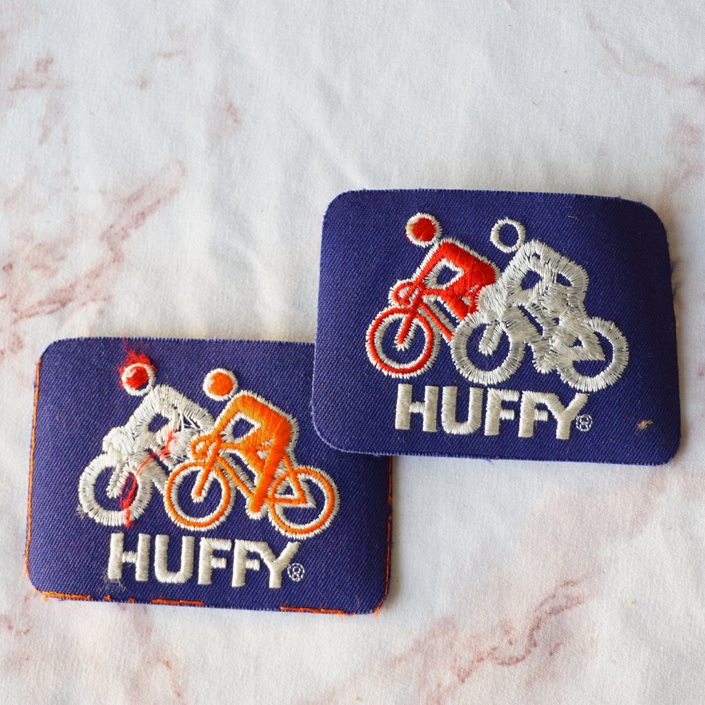 1980s Vintage 4" Set of 2 HUFFY Bikes Clothing Patch. Blue, Red and Orange Colors.