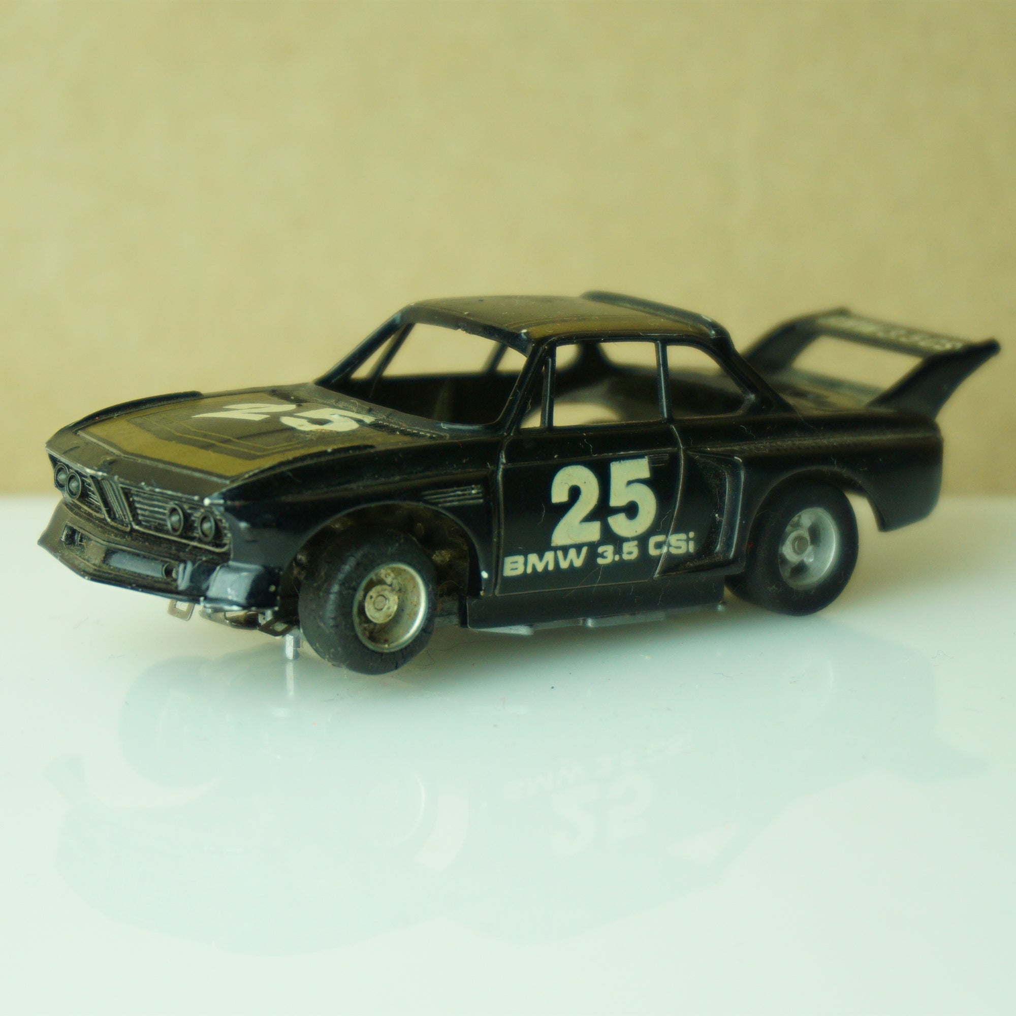 Vintage TYCO BMW 3.5 CSI #25 Stripes Black and Gold Slot Car. Made in Hong Kong.