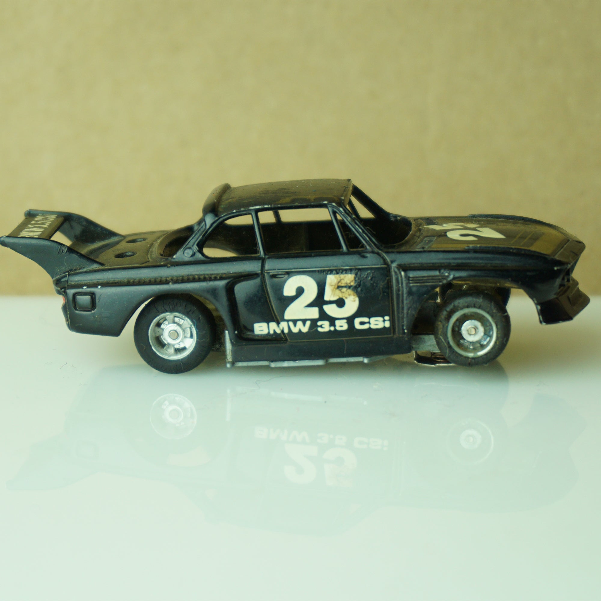 Vintage TYCO BMW 3.5 CSI #25 Stripes Black and Gold Slot Car. Made in Hong Kong.