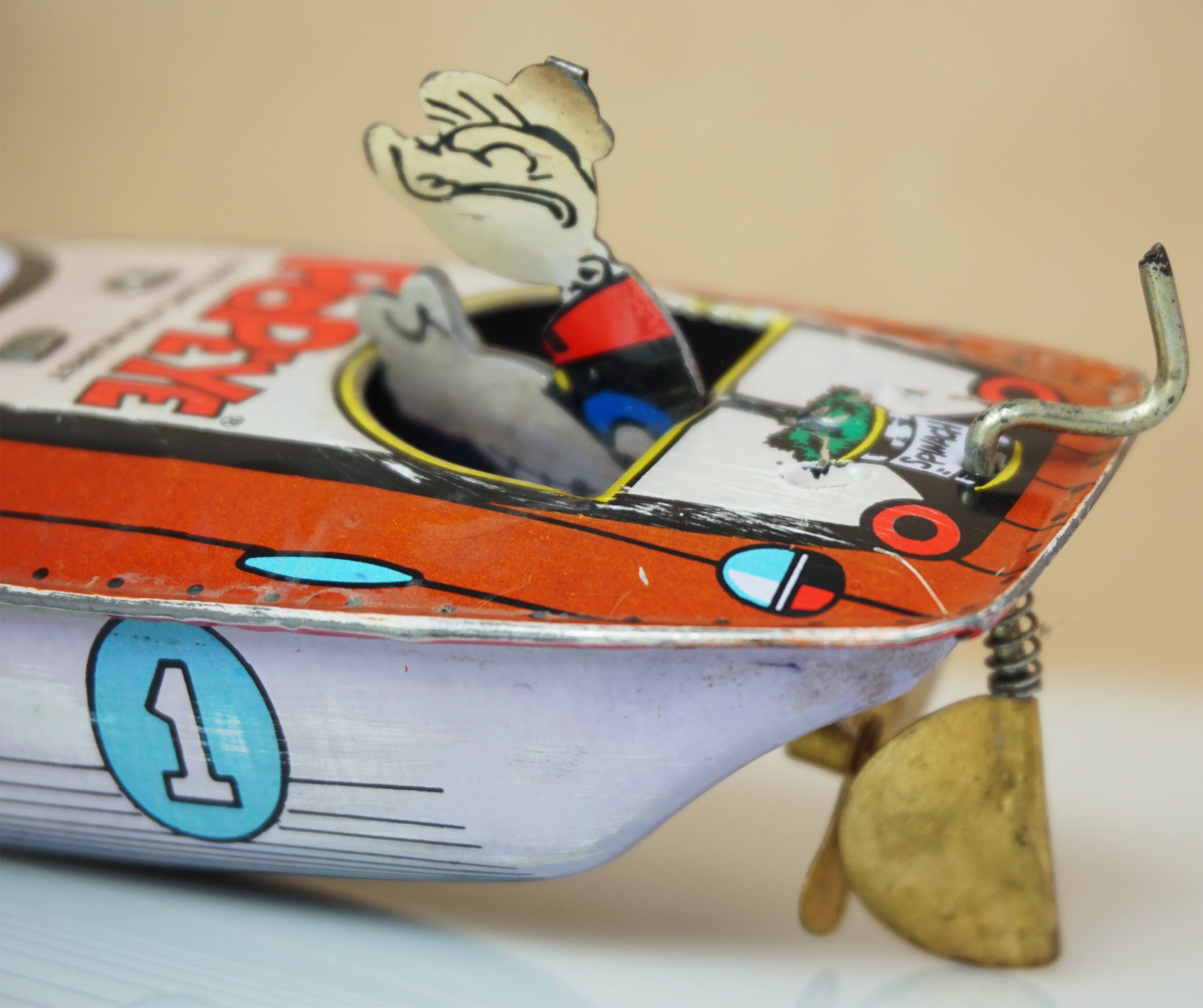 Popeye deals tin speedboat