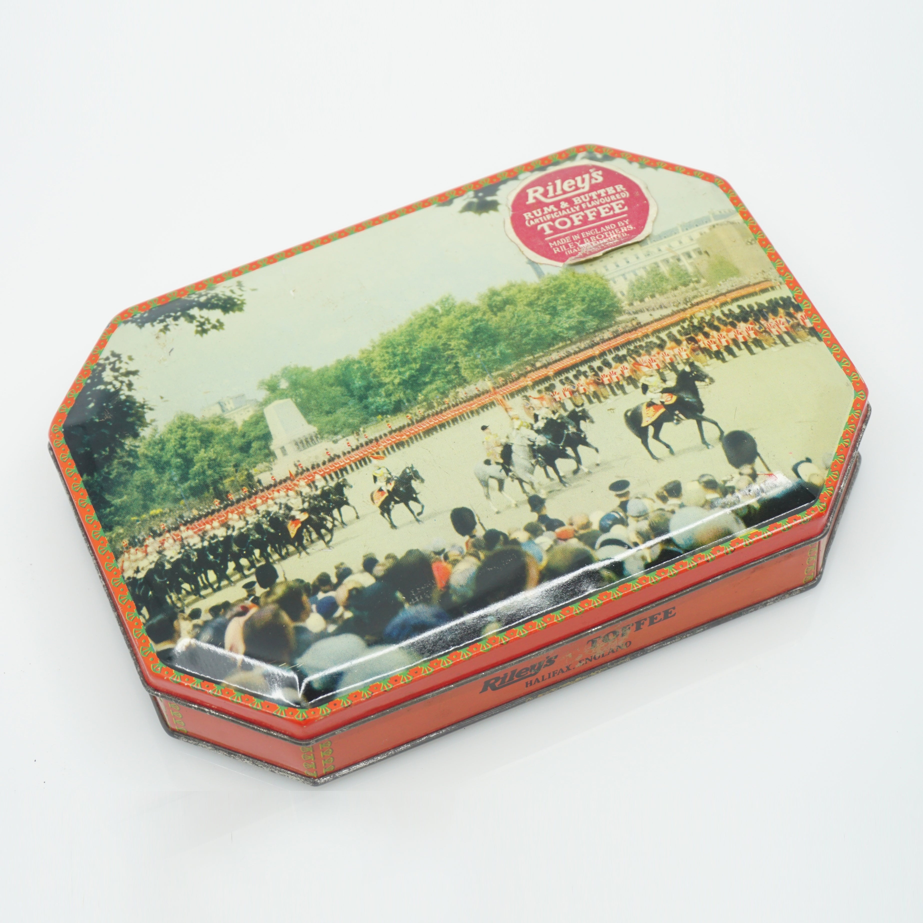 Vintage Riley's Toffee Tin Litho Container. Orange Sides, Horse Parade Scene Lid. 7" Wide.