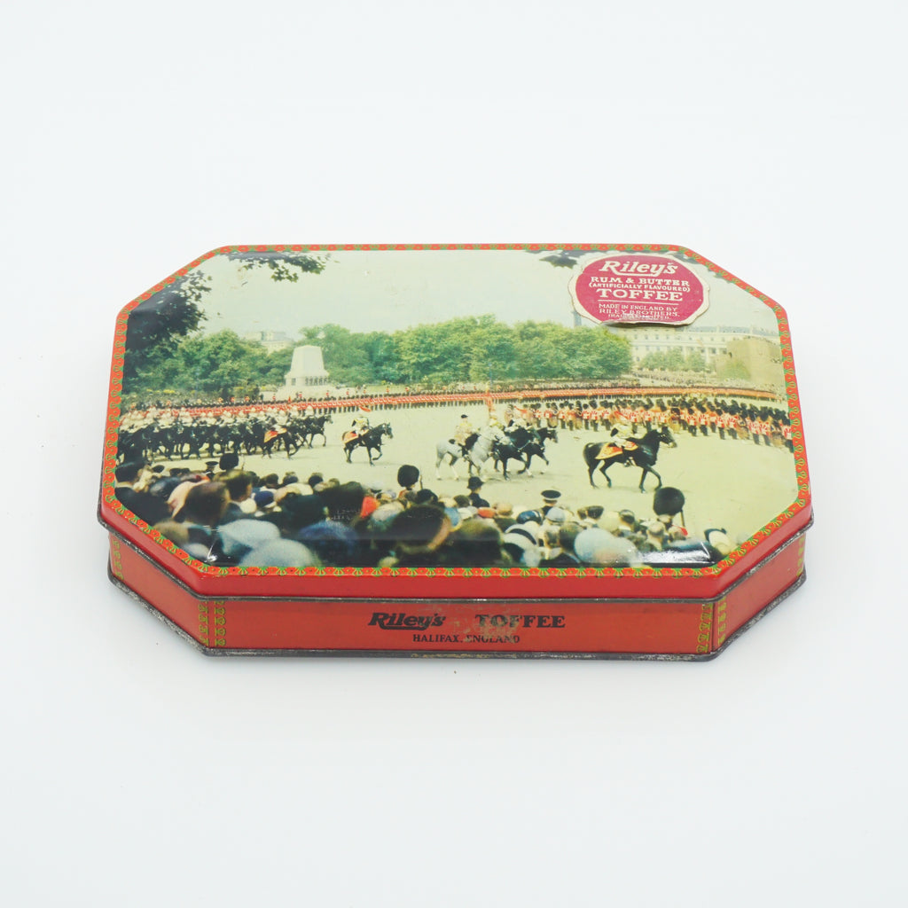 Vintage Riley's Toffee Tin Litho Container. Orange Sides, Horse Parade Scene Lid. 7" Wide.