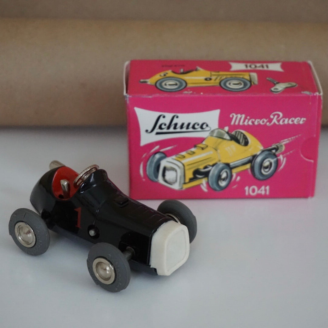 1990s Schuco Midget Micro Black Racer Car #1041. Red interior.