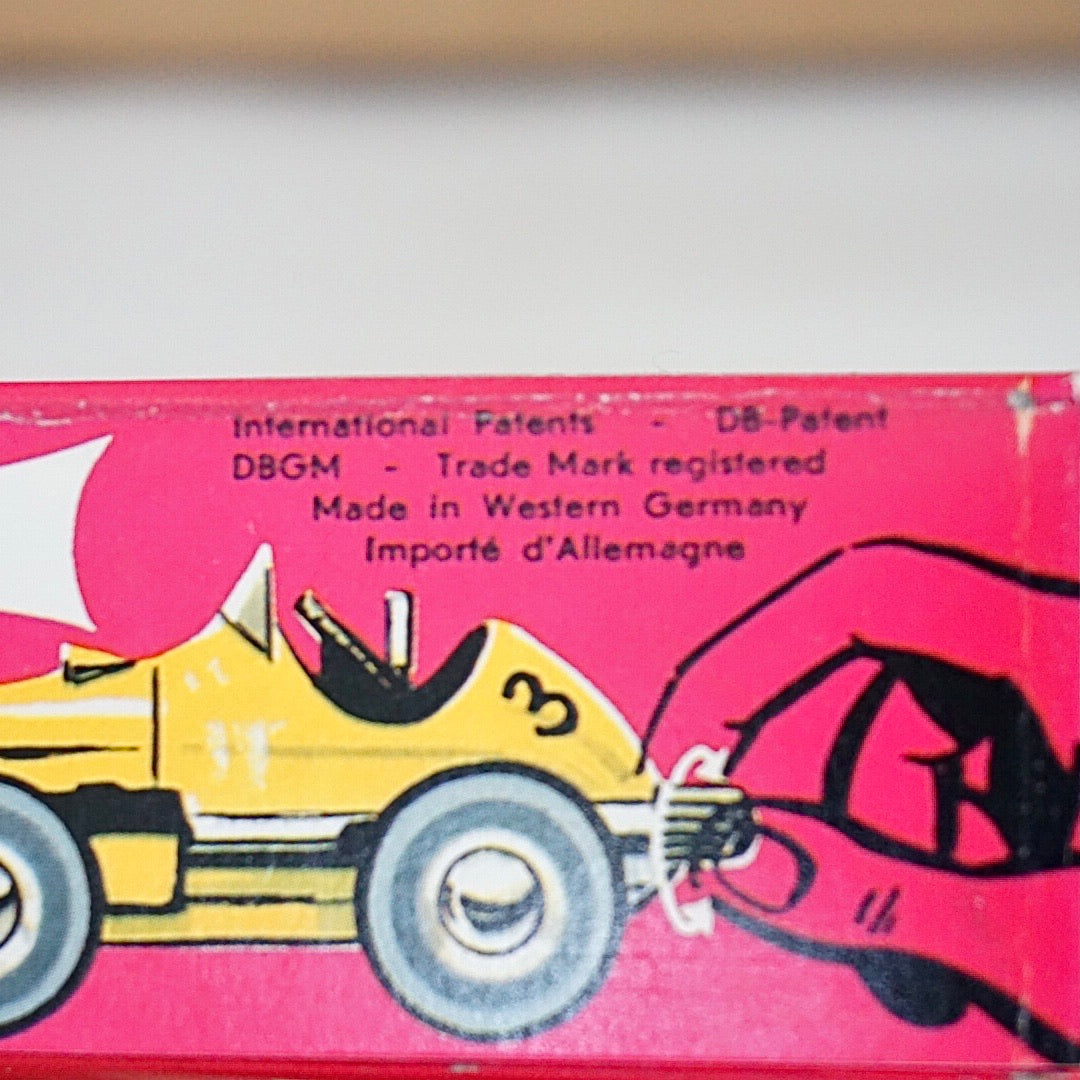 1990s Schuco Midget Micro Black Racer Car #1041. Red interior.