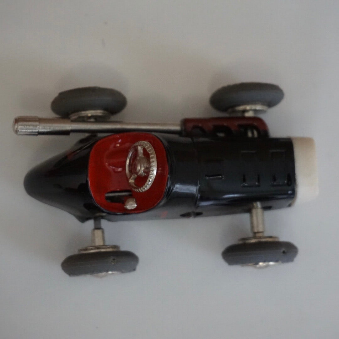 1990s Schuco Midget Micro Black Racer Car #1041. Red interior.