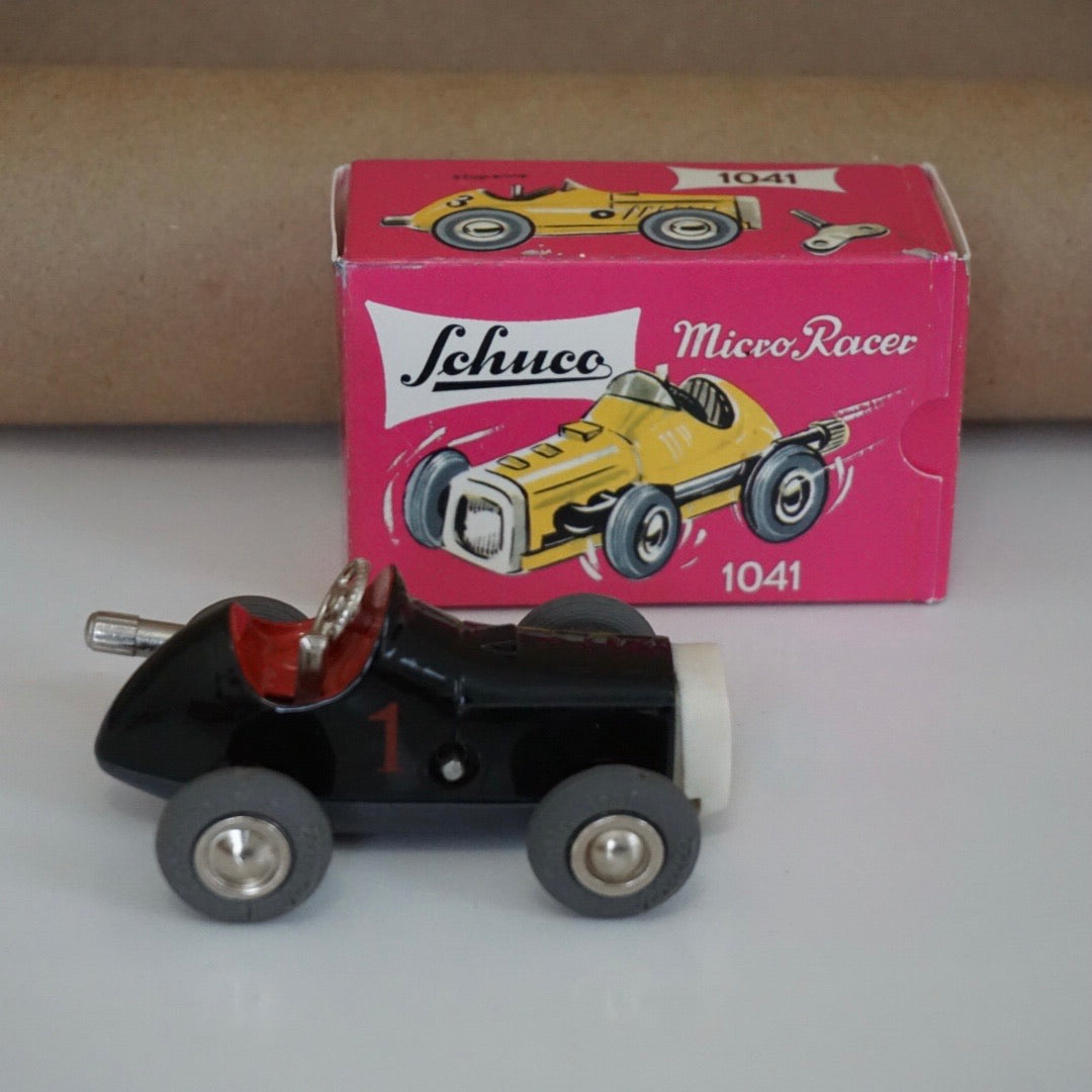 1990s Schuco Midget Micro Black Racer Car #1041. Red interior.
